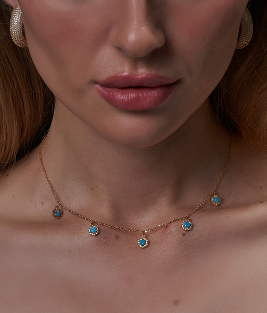 Gold necklace with blue stones
